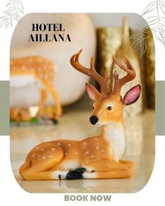 a wooden figurine of a deer sitting on a table at Ailana Hotel in Aqaba +88 photos