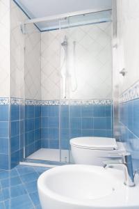 a bathroom with a shower and a toilet and a sink at Villa Alba - Rubino in Amalfi +38 photos