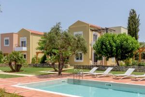 a villa with a swimming pool and a house at Aloni Grove Retreat in Chania