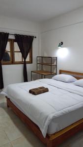 Postel nebo postele na pokoji v ubytování Bale hotel & Cowork