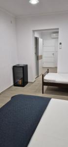 a living room with a couch and a fireplace at Rooms Lanterna in Metajna +18 photos