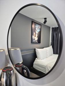 Postel nebo postele na pokoji v ubytování GALANG HOTEL