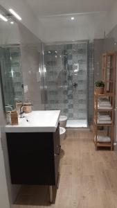 a bathroom with a sink and a shower at La Casa di MaGioLò in Serracapriola