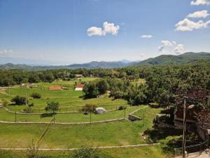 a view of a park with mountains in the background at Mountain Village House in Cetinje