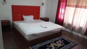 Postel nebo postele na pokoji v ubytování Hotel Thangshing In
