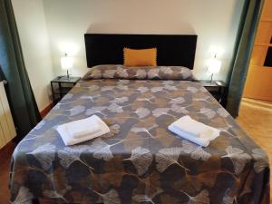 a bedroom with a bed with two pillows on it at Posidonia Guest House La Caletta Sardegna in La Caletta +36 photos