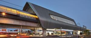 a building with a black roof and a street at Chic Murrumbeena Retreat in Murrumbeena
