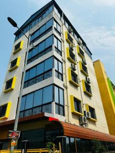 a tall building with windows on the side of it at Panama & Panama Hotel and Restaurant in New Town