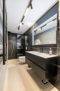 a bathroom with a sink and a toilet at Villa Lavea in Trogir +64 photos