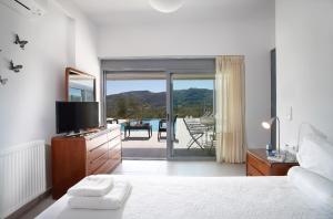 Posteľ alebo postele v izbe v ubytovaní Gramvousa Villas + 37 fotografií