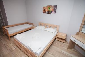 Postel nebo postele na pokoji v ubytování Hotel NATALI