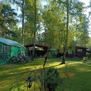a group of bikes parked next to a tent at Domek02 Ośrodek Wypoczynkowy Joanna Wojnowo Lubuskie in Kargowa