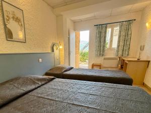 Postel nebo postele na pokoji v ubytování Hotel L'ondine