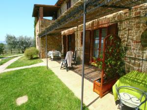 A garden outside Farmhouse with air conditioning, private terrace and pool