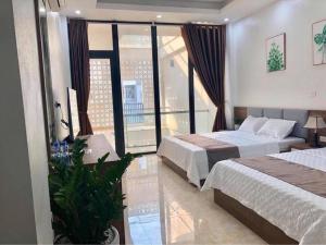 Katil atau katil-katil dalam bilik di Cô Tô Luxury