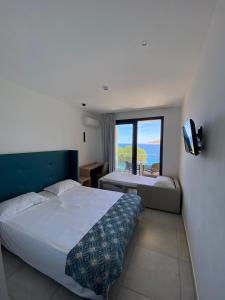 Ένα ή περισσότερα κρεβάτια σε δωμάτιο στο Hotel Restaurant Le Filosorma