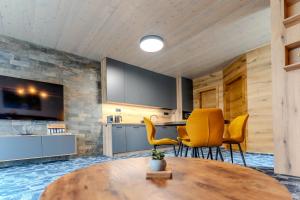 TV a/nebo společenská místnost v ubytování Apartmán F2 Hrabušice