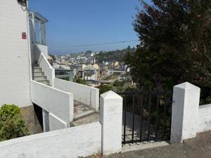 a set of stairs leading up to a house at Atalaya Luarca Apartamentos turísticos in Luarca