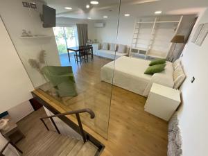 a bedroom with a bed and a glass wall at BellaVista in Taormina