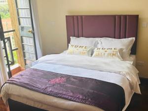 Ένα ή περισσότερα κρεβάτια σε δωμάτιο στο WPlace - Maggies Cozy Apartment