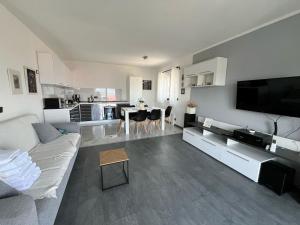 a living room with a couch and a table in it at Vila V & S in Star Dojran