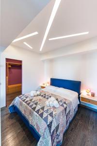 Posteľ alebo postele v izbe v ubytovaní The Loft Via Torricella