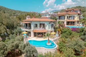 an aerial view of a house with a swimming pool at Villa Mandalina, Cukurbag Peninsula-Kas in Kaş