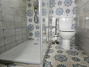 a bathroom with a toilet and a shower at Casa Peñascales -Laxe- Costa da Morte in Laxe +26 photos