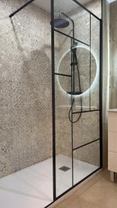 a glass shower with a glass shelf in a room at Casa Del Pequeno Tonelero & Casa Del Gran Tonelero - by El Tonelero Ltd in Sucina