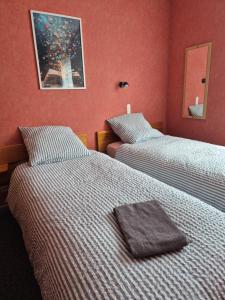 Postel nebo postele na pokoji v ubytování Auberge BÏN VENDÜD CHÂ NOUS