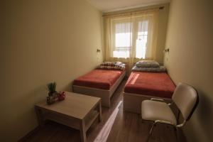 Postel nebo postele na pokoji v ubytování Velvet Łucka