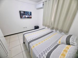 Ένα ή περισσότερα κρεβάτια σε δωμάτιο στο TH 3102 - Flat de 2 quartos com varanda