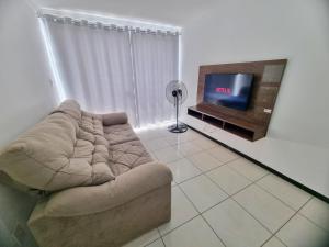 Μια τηλεόραση ή/και κέντρο ψυχαγωγίας στο TH 3102 - Flat de 2 quartos com varanda