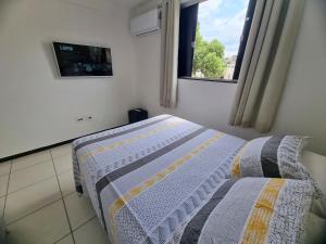 Ένα ή περισσότερα κρεβάτια σε δωμάτιο στο TH 3102 - Flat de 2 quartos com varanda