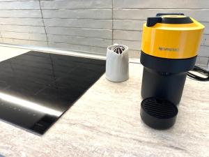 a blender sitting on a counter next to a laptop at Brand New !!! Ancient BOLOGNA Centrale LIBERTY Style Completely RENOVATED 2025 in Bologna