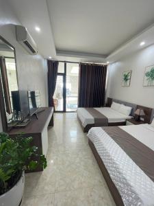 Postel nebo postele na pokoji v ubytování Ngọc anh luxury cô tô
