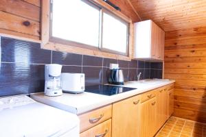 Η κουζίνα ή μικρή κουζίνα στο Mare E Monti Chalets