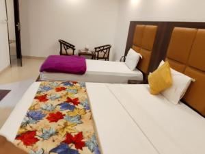 Postel nebo postele na pokoji v ubytování Hotel Star Simon delhi