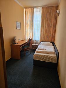 Letto o letti in una camera di Hotel Barbarossa