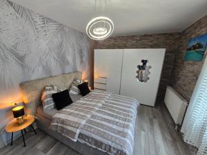 Posteľ alebo postele v izbe v ubytovaní Tom Apartmans