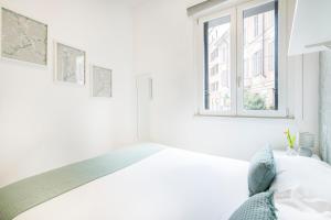 A bed or beds in a room at Easylife - Comodo trilocale in Porta Romana