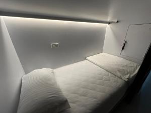 Postel nebo postele na pokoji v ubytování WANGTA Hostel