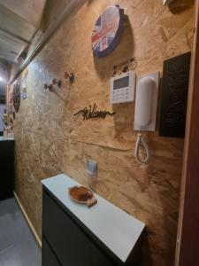 a room with a wall with a phone on it at Estudio PIZARRO DOWN TOWN in Torremolinos +23 photos