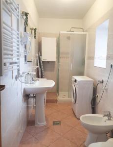 a bathroom with a toilet and a sink and a shower at Apartma Suzy in Bovec
