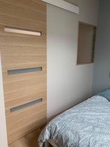 Postel nebo postele na pokoji v ubytování Maisonnette de charme en bord de mer
