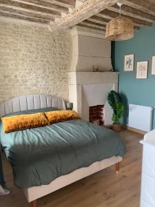 Postel nebo postele na pokoji v ubytování Maisonnette de charme en bord de mer