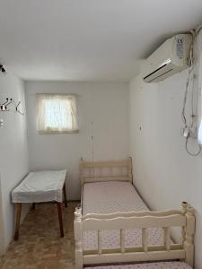 Postel nebo postele na pokoji v ubytování Kumborski Ribar
