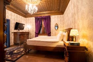 TV a/nebo společenská místnost v ubytování Castle Boutique Hotel
