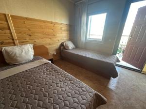 Postel nebo postele na pokoji v ubytování Микрон