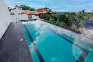 a swimming pool on the roof of a house at Spacious Home with Rooftop Pool in Malabe